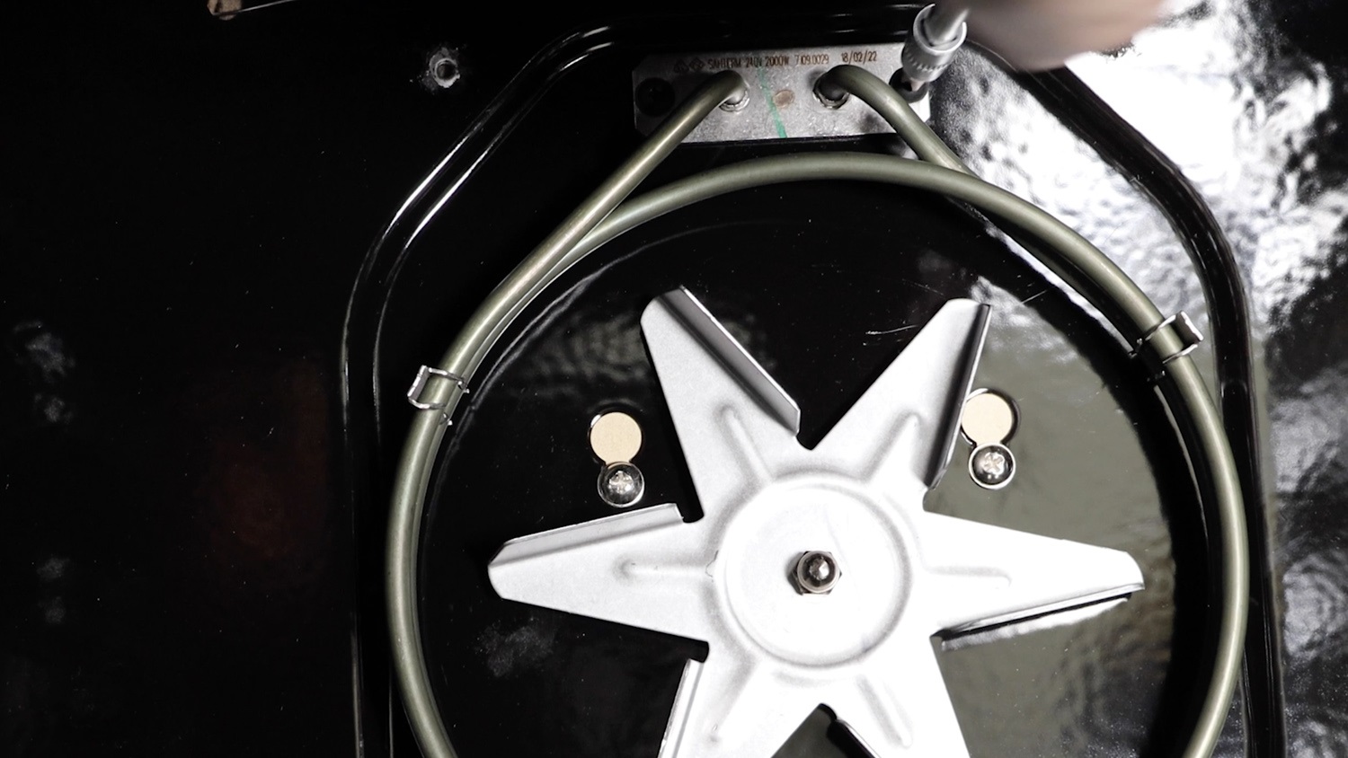 Remove top two screws from element
